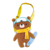 Sewing kit for kids featuring a soft Snowboarding Bear plush, pre-punched fabric, safety needle, and colorful stickers.