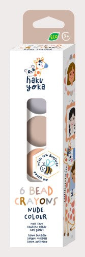 Eco-friendly Haku Yoka crayons featuring 6 creamy nude shades, made from 10% beeswax for vibrant coloring fun.