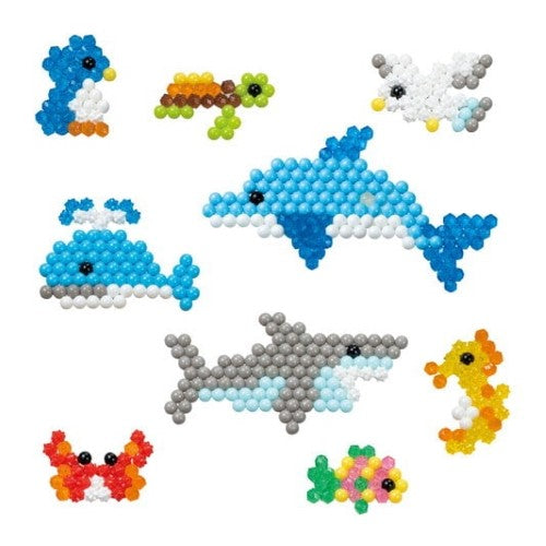 Colorful Aquabeads Ocean Life Refill Pack with 600+ beads, templates for ocean animals, and creativity tools for kids aged 4+.