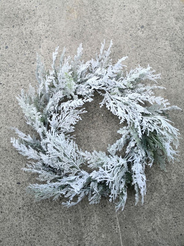 48" snowy cedar wreath with lush greenery, snowy accents, and pre-lit LED lights for festive holiday decor.