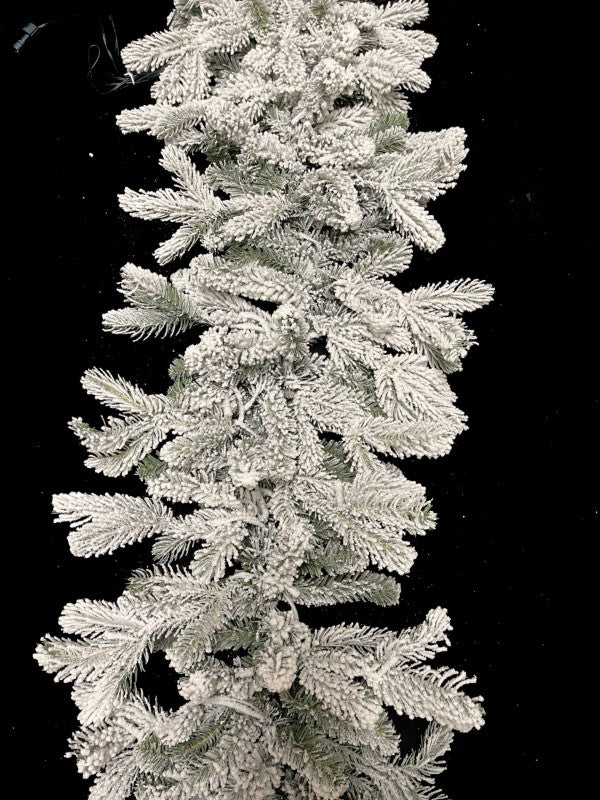 200 cm snowy garland with 324 tips and warm LED lights, perfect for adding festive elegance to your holiday decor.
