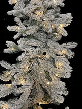 200 cm snowy Christmas garland with 324 tips and warm LED lights, perfect for festive decorating and creating a cozy atmosphere.