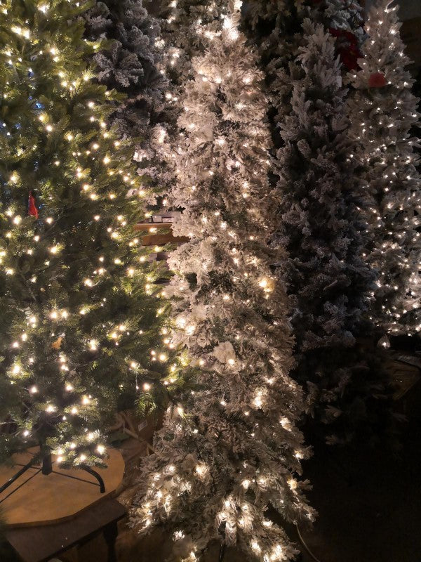 8' Heavy Snow Slim Pine Tree with 600 warm white LED lights, perfect for smaller spaces and festive holiday decor.