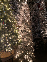 8' Heavy Snow Slim Pine Tree with 600 warm white LED lights, perfect for smaller spaces and festive holiday decor.