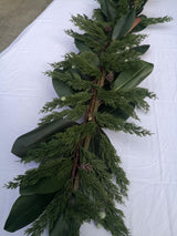 Lifelike 180cm juniper pine garland adorned with seeds, perfect for year-round home decor and easy maintenance.