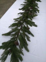 Lush 180cm artificial mixed pine garland with realistic branches and pinecones, perfect for festive decor year-round.