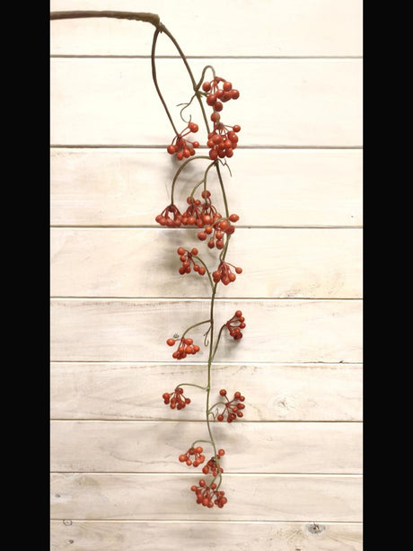 Lifelike hanging red berry spray with vibrant berries and lush green foliage, perfect for home decor and seasonal displays.