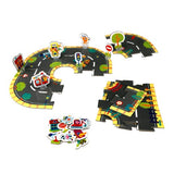 Colorful floor puzzle in a suitcase for kids to learn traffic rules while creating imaginative roads for toy cars.