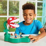 Colorful game set featuring Super Mario and Luigi action figures, Piranha Plant base, and exciting game board for family fun.