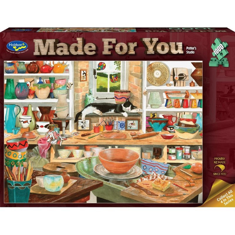 Jigsaw puzzle featuring a cozy potter's studio scene with cats, perfect for relaxation and creativity, made in New Zealand.