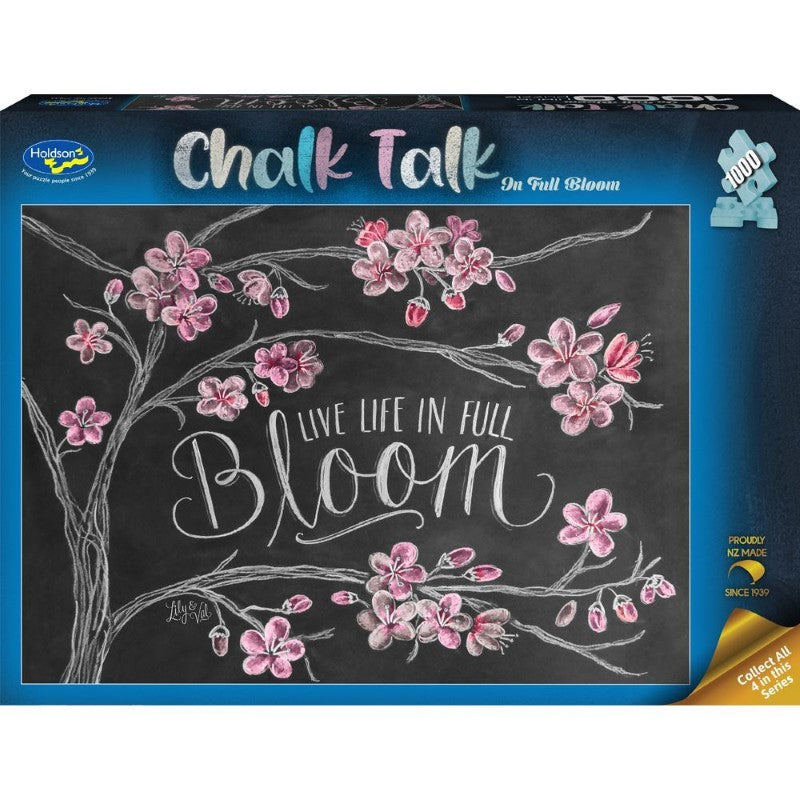 Vibrant floral puzzle titled 'In Full Bloom' on a chalkboard background, featuring 1000 quality pieces for all ages.