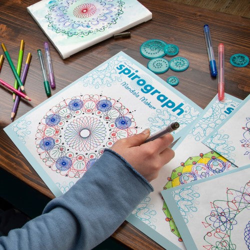 Spirograph Mandala Maker kit with frame, interchangeable wheels, stencils, papers, and pens for creating intricate mandala designs.