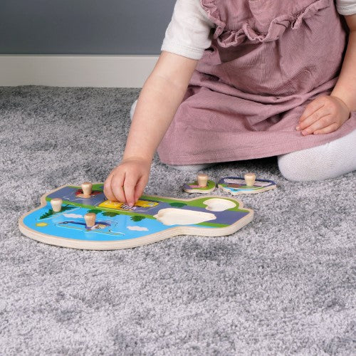 Colorful Wooden Peg Puzzle featuring Peppa Pig characters in transport vehicles, designed for enhancing children's fine motor skills.