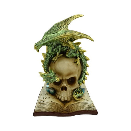 Ornament featuring a green dragon atop a skull on a book, with illuminated eyes for mystical decor appeal.