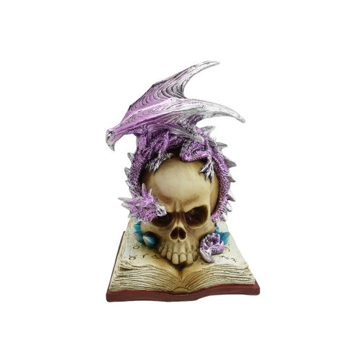 Ornament featuring a detailed skull on a book with a vibrant purple dragon, glowing eyes, and gothic allure.