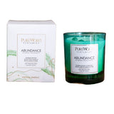 Abundance Sandalwood candle in an ombre jar with jade crystal, promoting prosperity and offering a soothing 50-hour burn.