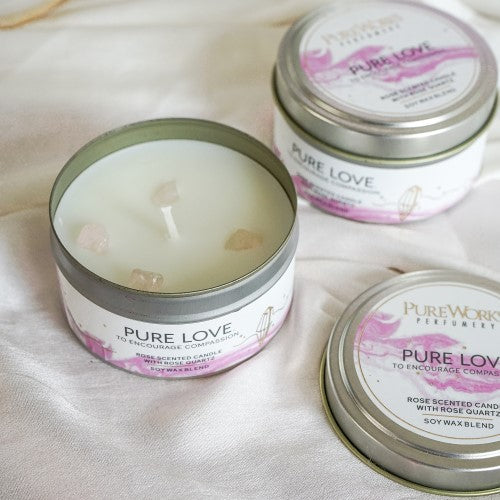 Pure Love Rose Candle: 80g rose-scented soy wax candle with Rose Quartz gemstones in a sleek metal tin, promoting love and tranquility.