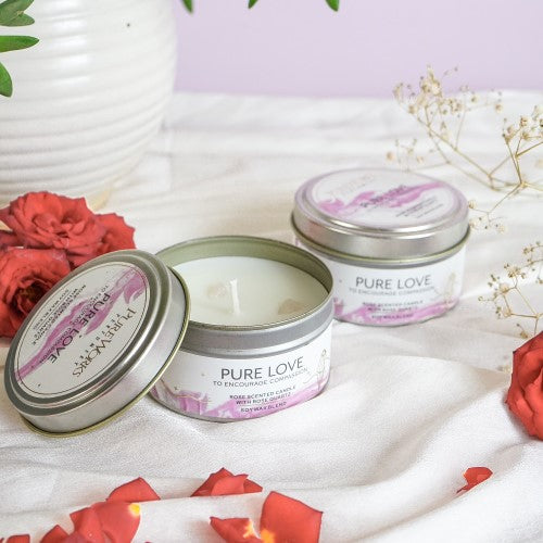 Pure Love Rose Candle in a metal tin, infused with rose scent and Rose Quartz, promotes love and tranquility, 10-hour burn time.