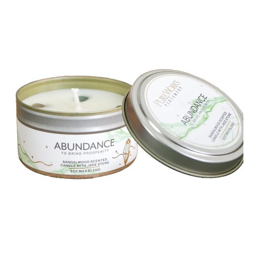 Abundance Sandalwood candle in a sleek tin, infused with jade crystal for prosperity and relaxation, burn time 10 hours.
