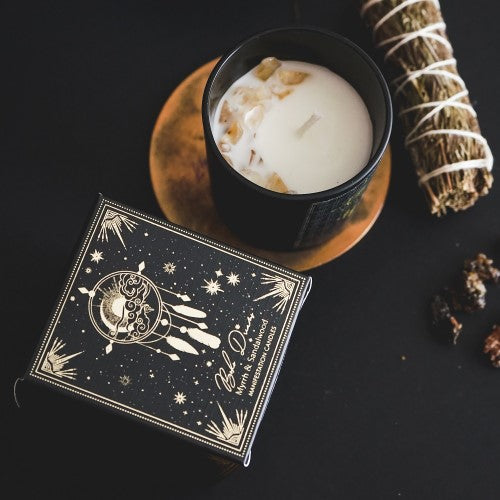 Black frosted glass candle with myrrh and sandalwood scents, gemstone chips, and eco-friendly soy wax, perfect for mindfulness.