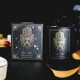 Good Fortune Patchouli & Orange Manifestation Candle in black frosted glass with gemstone chips, designed for positive energy and wellness.
