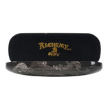 Elegant hard shell glasses case featuring Alchemy Gothic's 'Widow's Weeds' artwork, includes microfiber cleaning cloth.