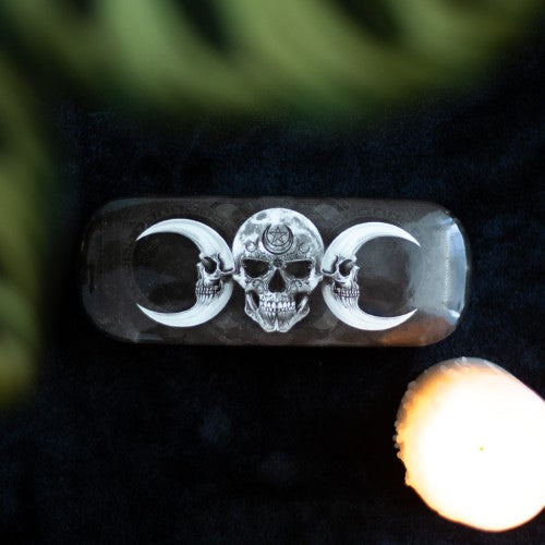 Gothic Dark Goddess glasses case with skull artwork; hard shell, includes microfiber cloth for cleaning lenses.