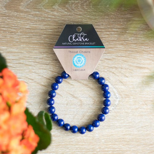 Throat Chakra Lapis Lazuli Bracelet with 8mm beads, promoting communication and chakra healing with vibrant blue hues.