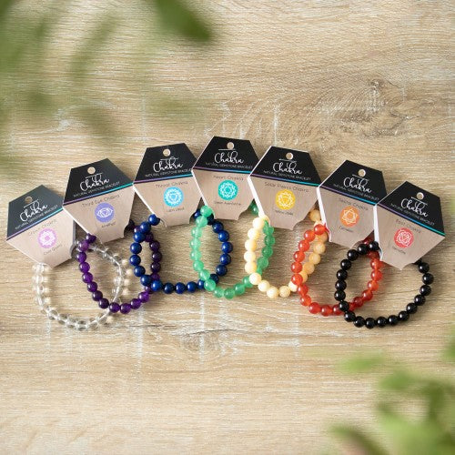 Crown Chakra Clear Quartz Gemstone Bracelet with 8mm beads, promotes balance, spirituality, and inner wellbeing.