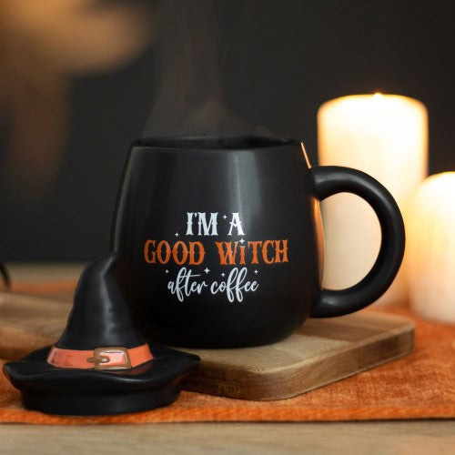 Whimsical 'I'm a Good Witch After Coffee' mug with a witch hat lid, perfect for adding magic to your morning brew.