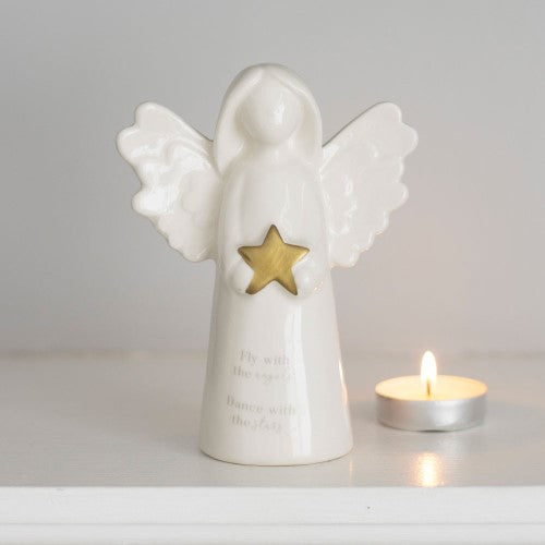 Delicate white ceramic angel ornament with gold star, inscribed 'Fly with the angels, Dance with the stars.' Perfect for remembrance.