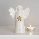 Delicate white ceramic angel ornament with gold star, inscribed 'Fly with the angels, Dance with the stars.' Perfect for remembrance.