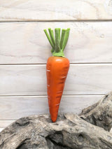 Vibrant artificial carrot for home decor, events, or as a charming centerpiece with lifelike detail and easy maintenance.