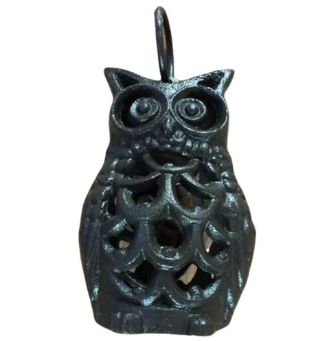 Charming cast iron owl candle holder for outdoor spaces, perfect for tea lights with intricate detailing and rustic finish.