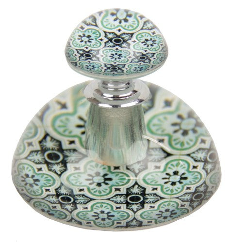 Elegant Moroccan style glass perfume bottle in rich teal, perfect for decor or storing fragrances.