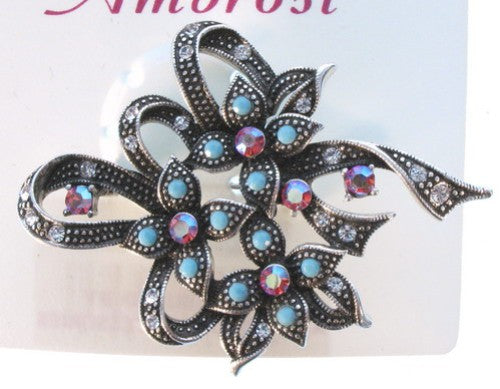 Elegant floral brooch featuring intricate design, perfect for any occasion and adds charm to outfits.