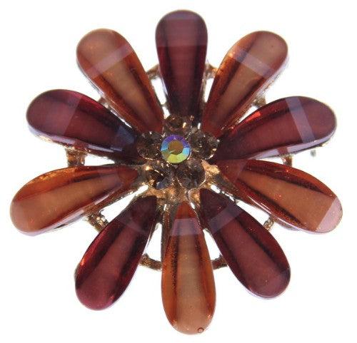Large floral brooch featuring sparkling stones, perfect for elevating any outfit with elegance and charm.