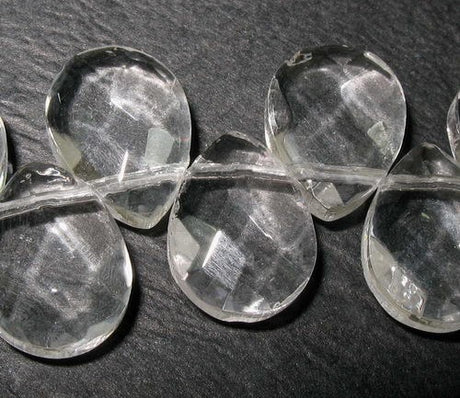 Teardrop-shaped glass beads in vibrant colors, perfect for jewelry making and crafts, 9x12mm, 47 pieces.