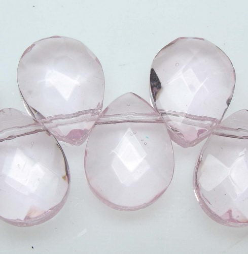 Flat faceted pinkish teardrop beads, 9x12mm, in a pack of 47 for elegant jewelry-making projects.
