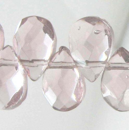 Faceted teardrop beads set of 61, 6x9mm, reflecting light for stunning jewelry and DIY projects.
