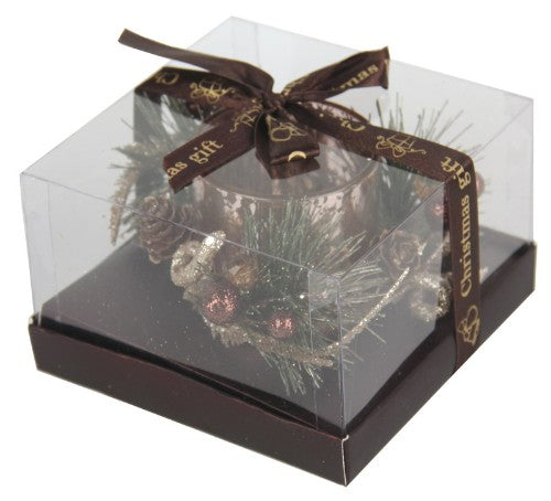 Small glitter votive holder in colored electroplate glass, accented with a brown ribbon, perfect for cozy atmospheres.