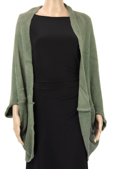 Versatile green cape that transforms from a cozy shrug to a chic scarf, perfect for any occasion and outfit layering.