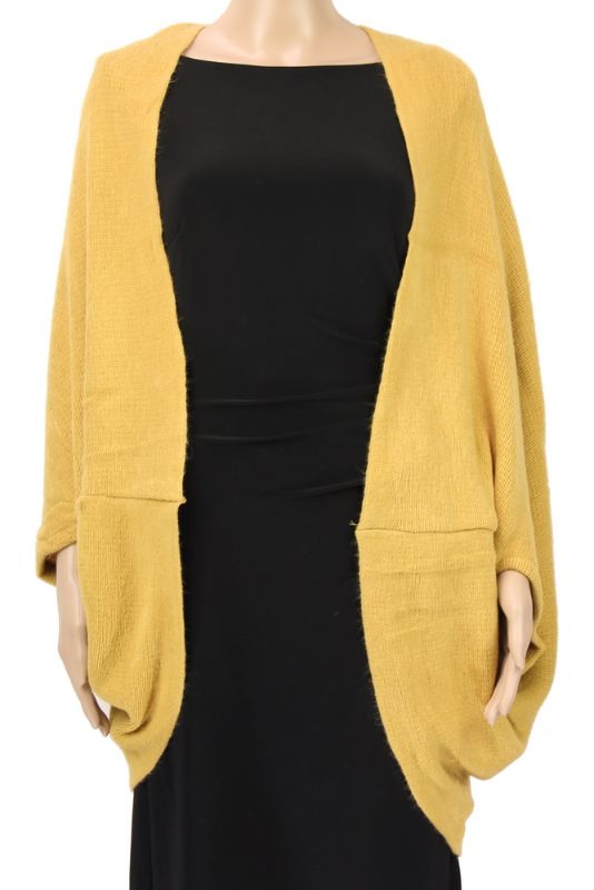 Mustard dual-use cape shrug that converts to a scarf, adding warmth and style to any outfit for versatile fashion.