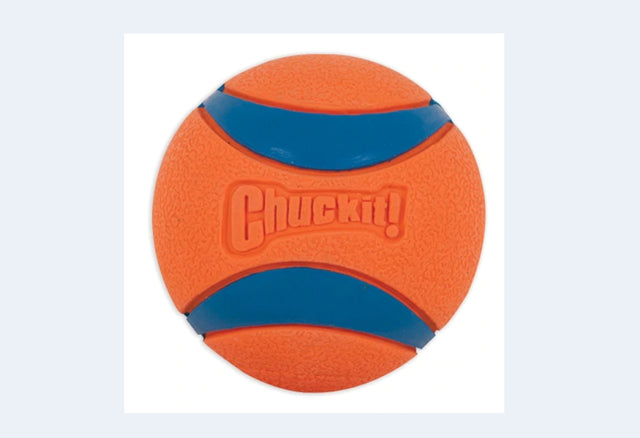 Brightly colored Ultra Ball XXL for dogs, designed for fetch with high bounce, buoyancy, and durability for active play.