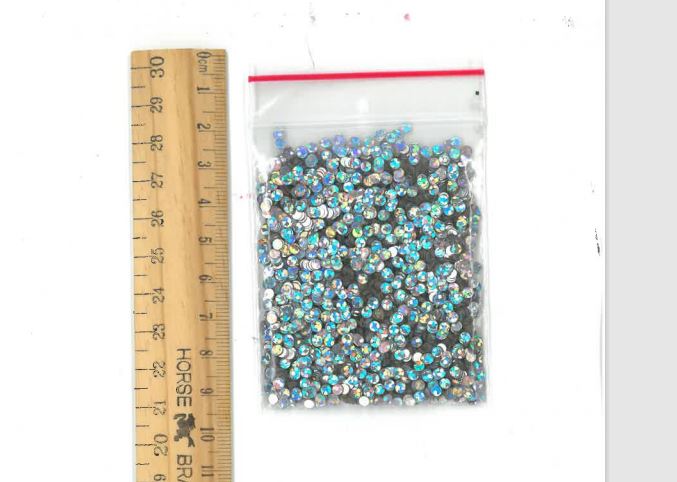 Holographic Glitter Dots in various sizes, perfect for adding vibrant shimmer to crafts, decorations, and custom artwork.