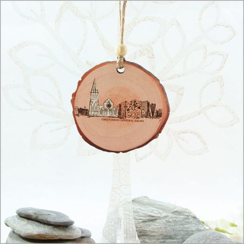 Wood slice ornament featuring Christchurch's landscapes, laser-cut and printed on both sides, perfect for festive decor.