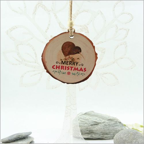 Kiwi-themed wood slice ornament, intricately laser cut with a rustic finish, perfect for festive decor or thoughtful gifting.