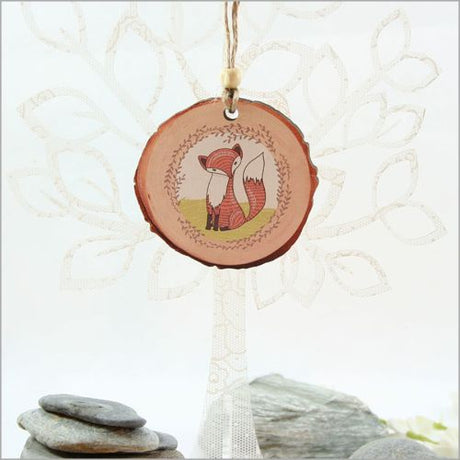 Charming Mr. Fox wood slice ornament, laser-cut with vibrant watercolor design, perfect for holiday decor and gifting.