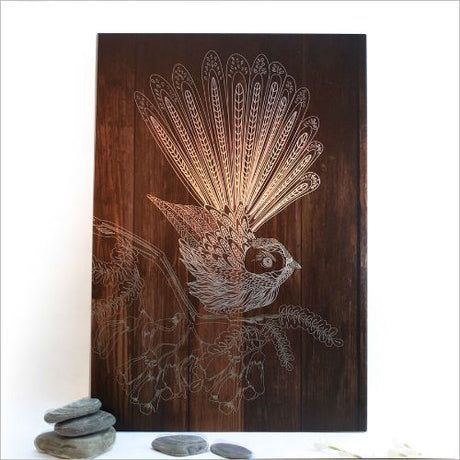 Kiwiana Wall Art featuring a dark wood fantail design on brushed silver ACM, perfect for enhancing indoor or outdoor spaces.