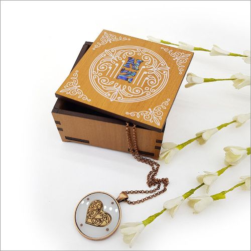 Elegant square trinket box with NZ veneer and paua inlay, perfect for storing keepsakes and enhancing home decor.